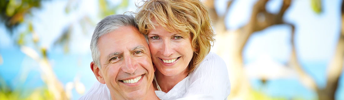 Senior Couple At Beach Smiling