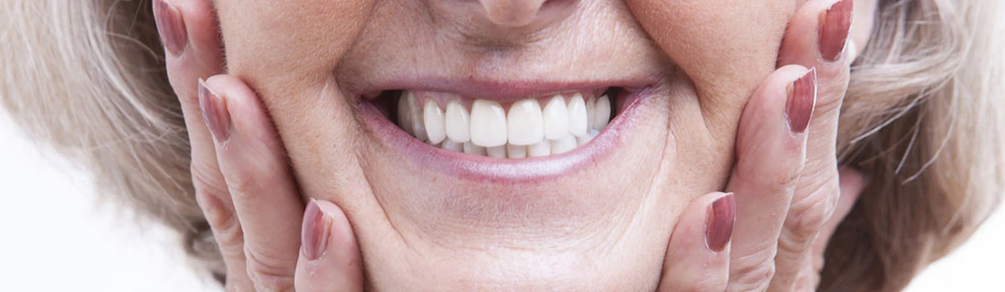 Senior Woman With Dentures Smiling CloseupSenior Woman With Dentures Smiling Closeup