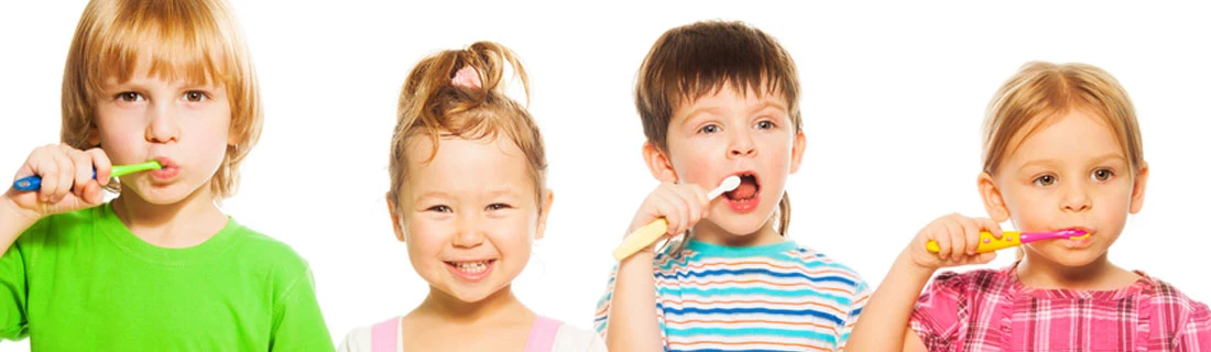 Group Of Kids Brushing Teeth