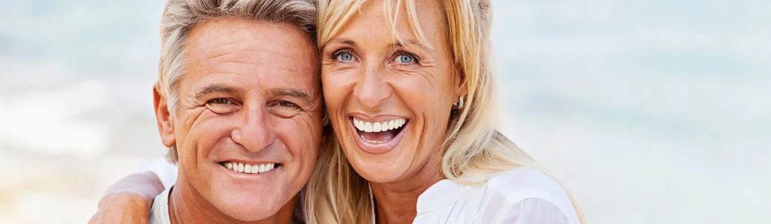 Couple Older At Beach Smiling