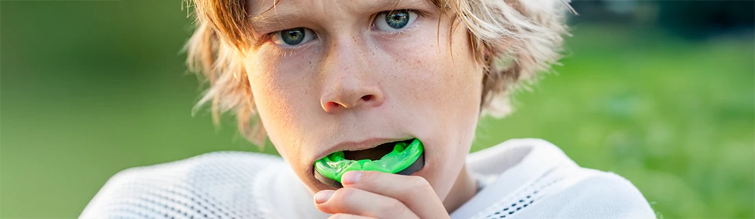 Boy Putting In His Mouth Guard