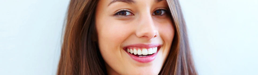 Woman With A Nice Smile On A Blue Background